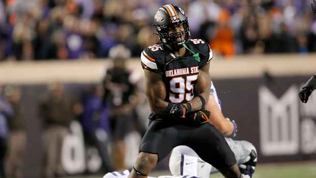 Oklahoma State's Jaleel Johnson (95) celebrates his sack on Kansas State's Will Howard (18) in the first half of the college football game between the Oklahoma State University Cowboys and the Kansas State Wildcats at Boone Pickens Stadium in Stillwater. Okla., Friday, Oct. 6, 2023.  